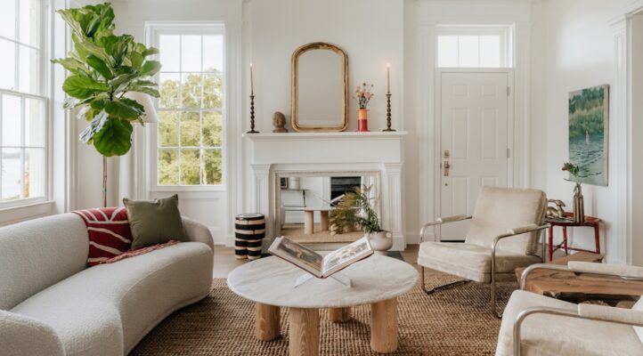 Bright and airy modern living room, professionally staged with neutral furniture and tasteful decor, showcasing a high-val...